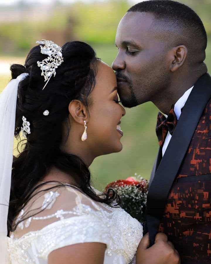 Joel Ssenyonyi Placing A Forehead Kiss On Wife.