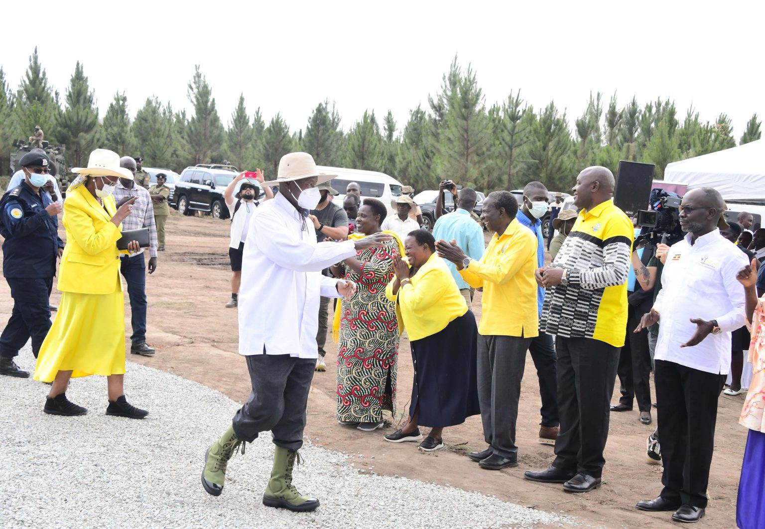 Museveni and His wife wave to ministers and the locals