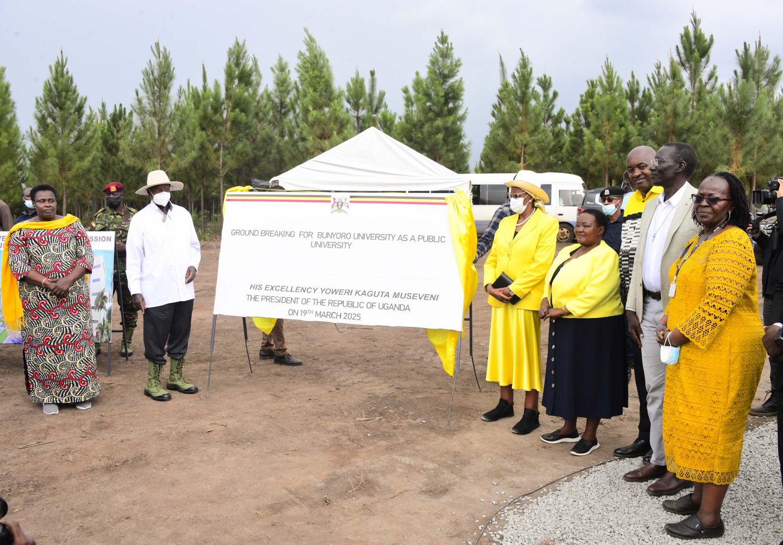 Guests hold Ground breaking banner for Bunyoro University