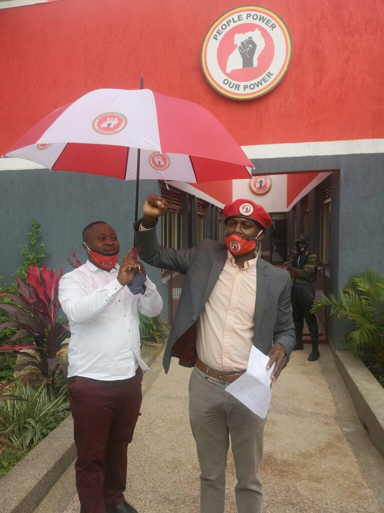 Andrew Mwenda gets a feel of the NUP party umbrella