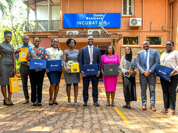 The MTN Team led by Senyonga 6L and the Stanbic Innovator team led by Poran 4R pose for a group photo after exchanging gifts.