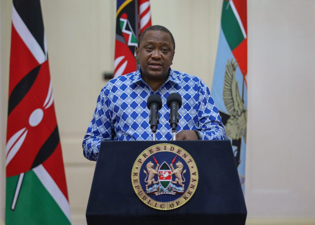 Kenyan President, Uhuru Kenyatta addressing an audience at his podium 