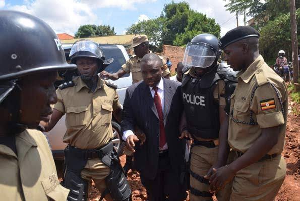 Erias Lukwago and Police Officers During One of his Numerous Arrests