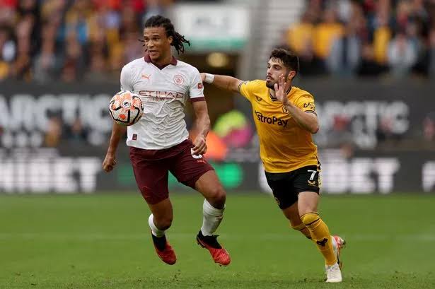 Nathan Ake and Pedro Neto tussling for the ball