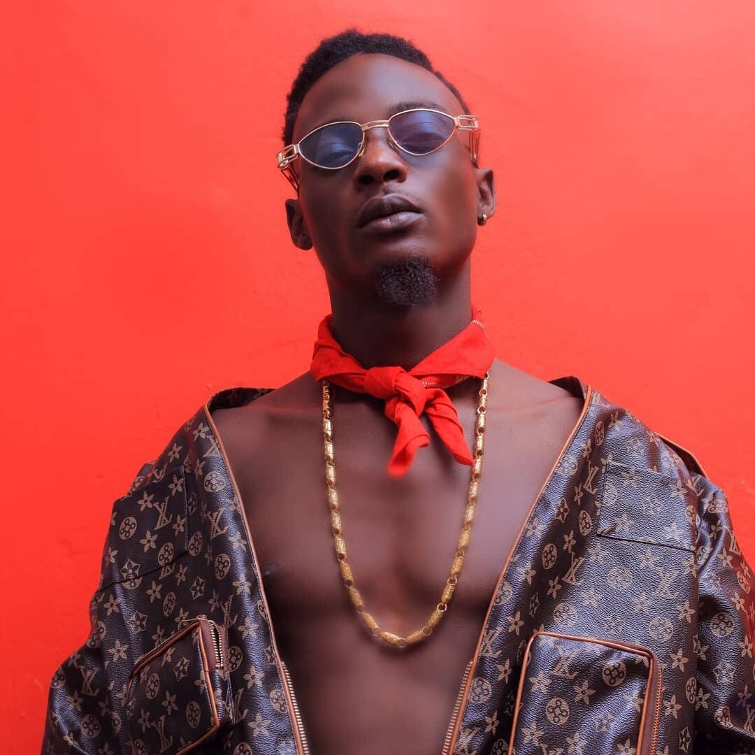 AgaNaga Khalifah, a Ugandan male musician poses in Luis Vuitton Jumper 