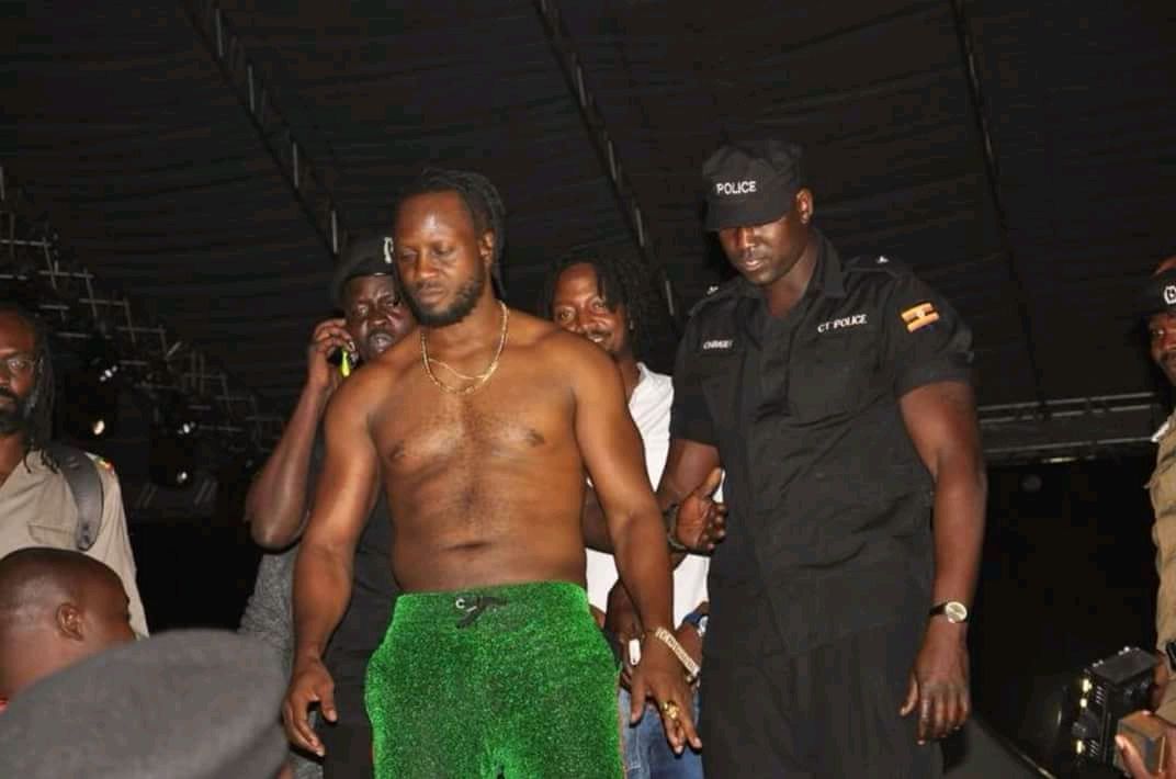 Police Helps Shirtless Bebe Cool Get to Safety After Nasty People Power Encounter.